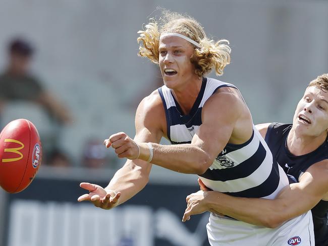 MELBOURNE , AUSTRALIA. February 22  , 2024.  AFL. Carlton vs Geelong at Princes Park.   Sam De Koning of the Catsclears by hand during the 1st qtr.    . Pic: Michael Klein