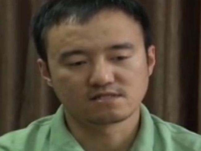 This screen grab taken from a CCTV footage shows Wang Xiaolu, a financial journalist with the respected business magazine Caijing, confessing on China's main state broadcaster on August 31, 2015. China's main state broadcaster on August 31 paraded Wang Xiaolu 