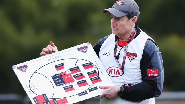 John Worsfold moves the magnets at Essendon training.