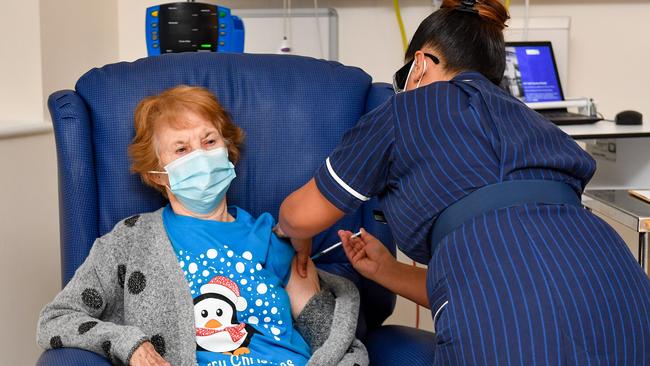 No crisis actor: Margaret Keenan, then 90, becomes the first patient in the United Kingdom to receive the Pfizer/BioNtech Covid-19 vaccine at University Hospital, Coventry. Picture: Jacob King /Getty Images