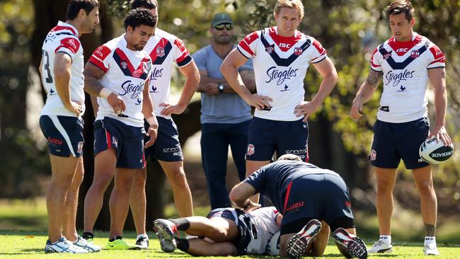 The Roosters watch a wrestling drill during training.