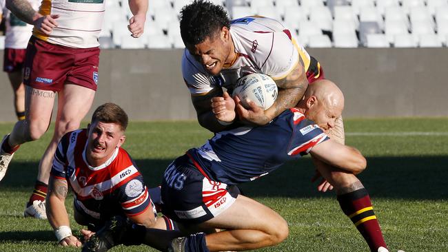 Thirlmere's Jacob Loko tests Brad Speechley. Picture: John Appleyard