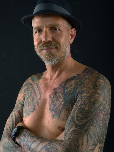 Award winning Perth architect hides spectacular Buddha tattoos | Daily  Telegraph