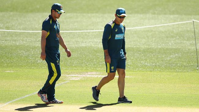 Travis Head inspects the Adelaide Oval wicket with coach Justin Langer. Pic: Getty Images