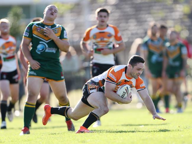 Grant Nelson goes in to score at Central Coast Division Rugby League first grade grand final between Wyong Roos and The Entrance Tigers at Woy Woy Oval last year. (AAP Image/Sue Graham