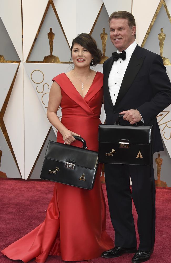 Martha L. Ruiz, left, and Brian Cullinan from PricewaterhouseCoopers arrive at the Oscars. Picture: AP