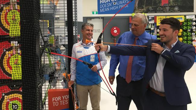 Decathlon Australia chief executive Olivier Robinet, Rowville state Liberal MP Kim Wells and Knox Mayor Jake Keogh try out archery in-store.