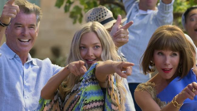 This image released by Universal Pictures shows, foreground from left, Julie Walters, Pierce Brosnan, Amana Seyfried and Christine Baranski in a scene from "Mamma Mia! Here We Go Again." (Jonathan Prime/Universal Pictures via AP)