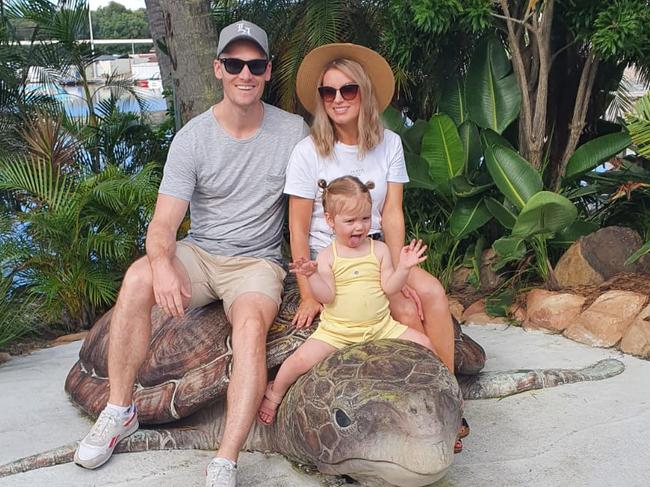 Matt and Jaimee Flemming with daughter Audrey on holiday in Queensland last year. Picture: Supplied