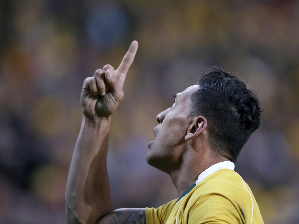 Folau points to the sky after scoring a try against England during their rugby union test match in Sydney on June 25, 2016. Picture: Rick Rycroft/AAP