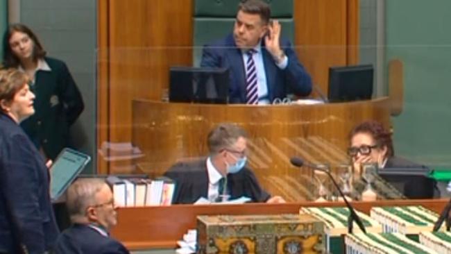 Parliamentary clerks looked confused after Speaker Milton Dick, at top of image, ordered the doors to be shut.