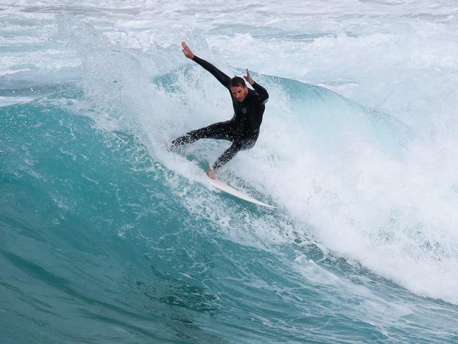 Massive swells pound NSW coast as state shivers