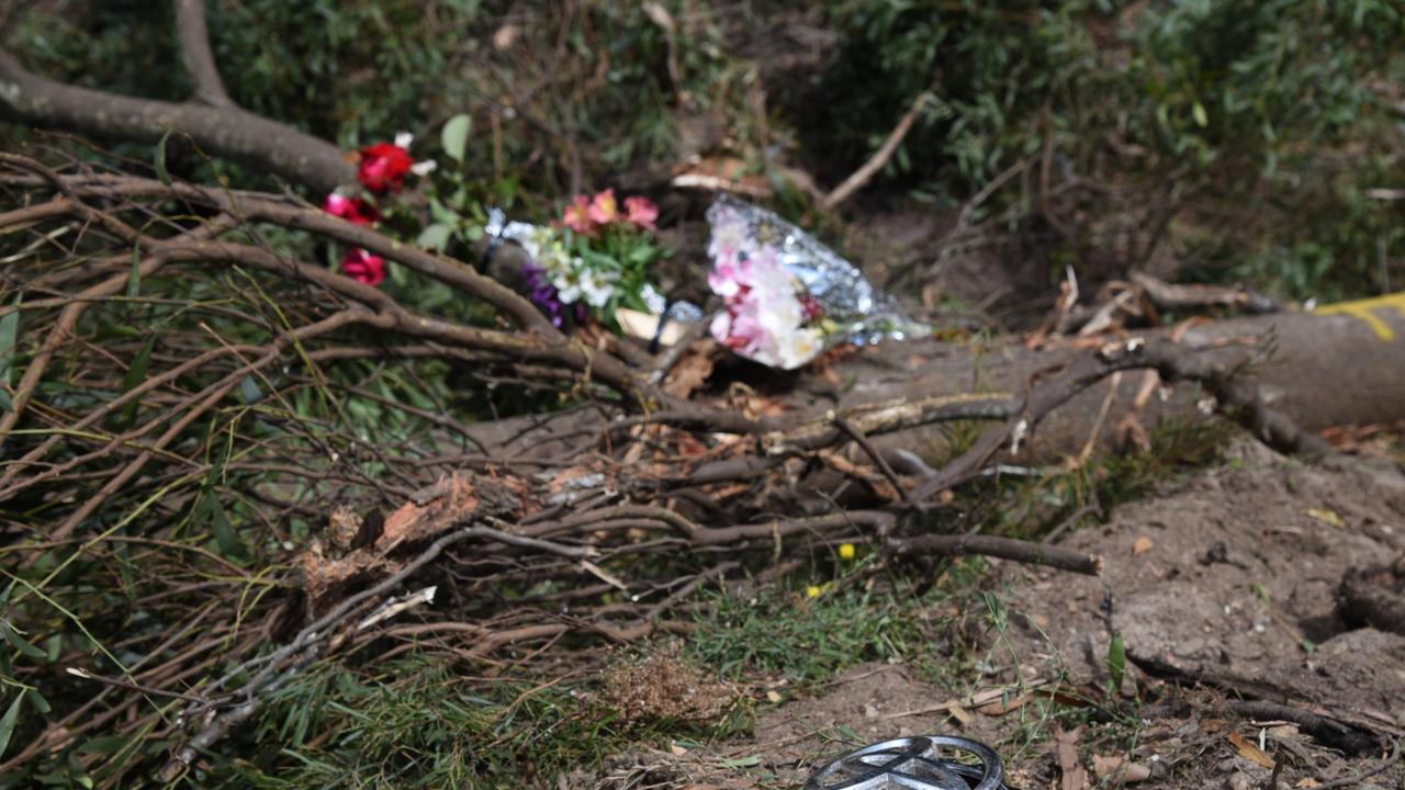 Floral tributes and vehicle detritus at the scene of the double fatal rollover at Somerset, March 11, 2022. Picture: Alex Treacy.