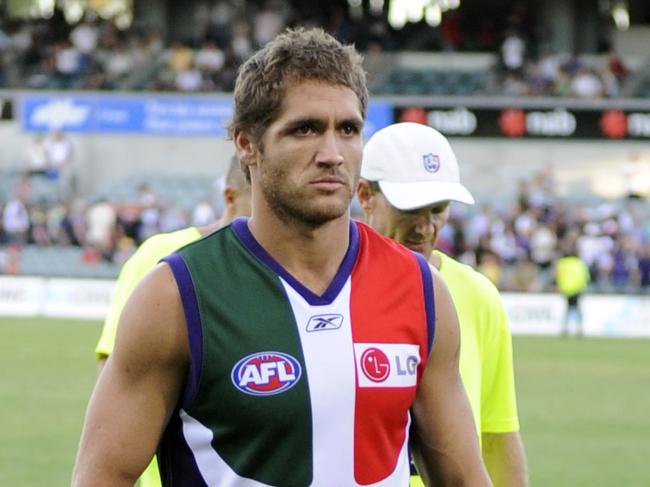 AFL football - Fremantle Dockers vs Richmond match at Subiaco Oval. Injured footballer Des Headland leaves the ground after losing to the Tigers.