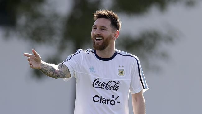 Argentina's Lionel Messi smiles during a training session.