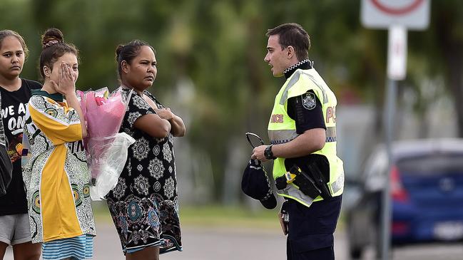 Mourners at the scene. PICTURE: MATT TAYLOR.