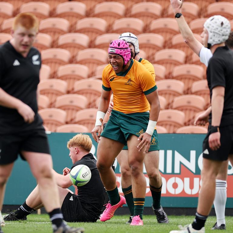 Joshua Takai celebrates scoring during the match between Australia Under-18s and New Zealand Schools.