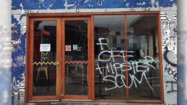 The vandalised front of 8-Bit burger store in Footscray.