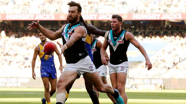 Port Adelaide’s Charlie Dixon kicks the ball against the West Coast Eagles at Optus Stadium. Picture: Will Russell/Getty