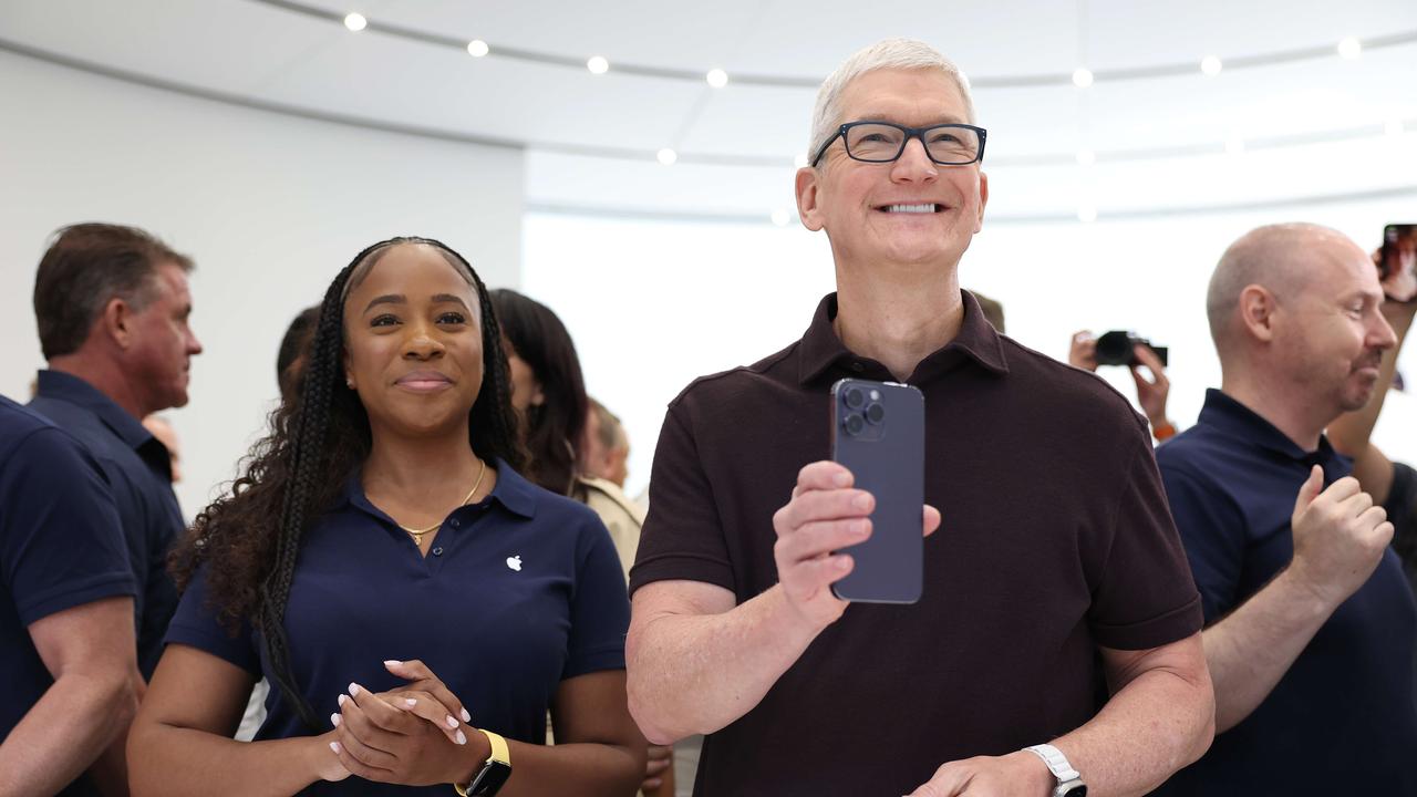 Apple CEO Tim Cook holds a new iPhone 14 Pro during the Apple special event in Cupertino, California. Picture: Justin Sullivan/Getty Images/AFP