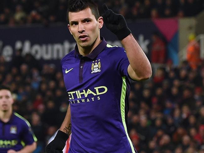 Manchester City's Argentinian striker Sergio Aguero celebrates after scoring their third goal from the penalty spot during the English Premier League football match between Stoke City and Manchester City at the Britannia Stadium in Stoke-on-Trent, central England, on February 11, 2015. AFP PHOTO / PAUL ELLIS RESTRICTED TO EDITORIAL USE. No use with unauthorized audio, video, data, fixture lists, club/league logos or “live” services. Online in-match use limited to 45 images, no video emulation. No use in betting, games or single club/league/player publications.