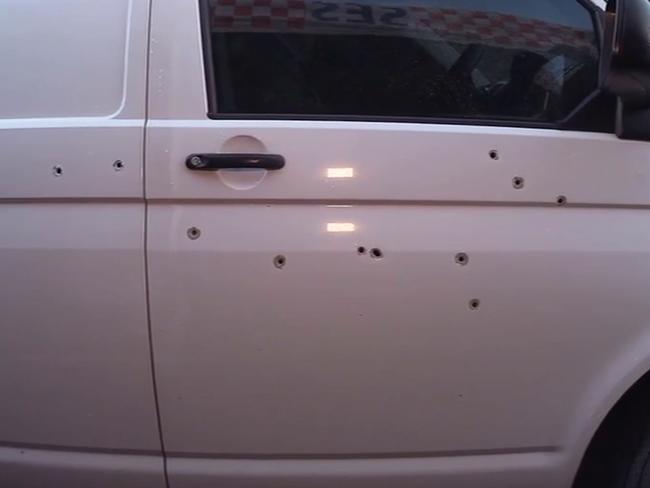 Bullet holes in the side of Virgona’s van.