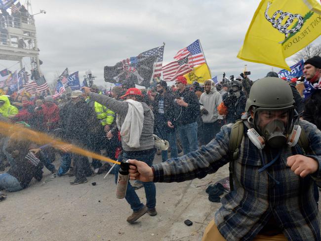 Trump supporters clash with police and security forces as people try to storm the US Capitol Building in Washington, DC, on January 6, 2021. Picture: AFP