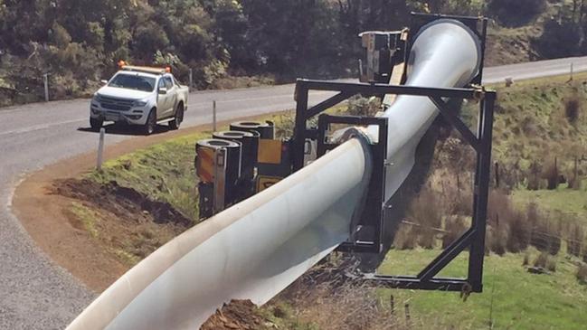 A truck carrying an 80m turbine recently rolled in Tasmania. Picture: TASMANIA POLICE