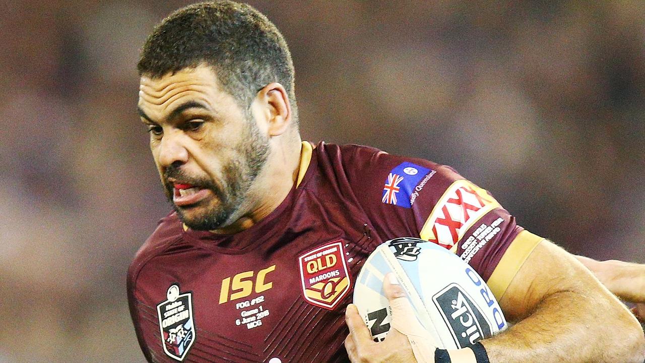 Greg Inglis of the Maroons runs with the ball.