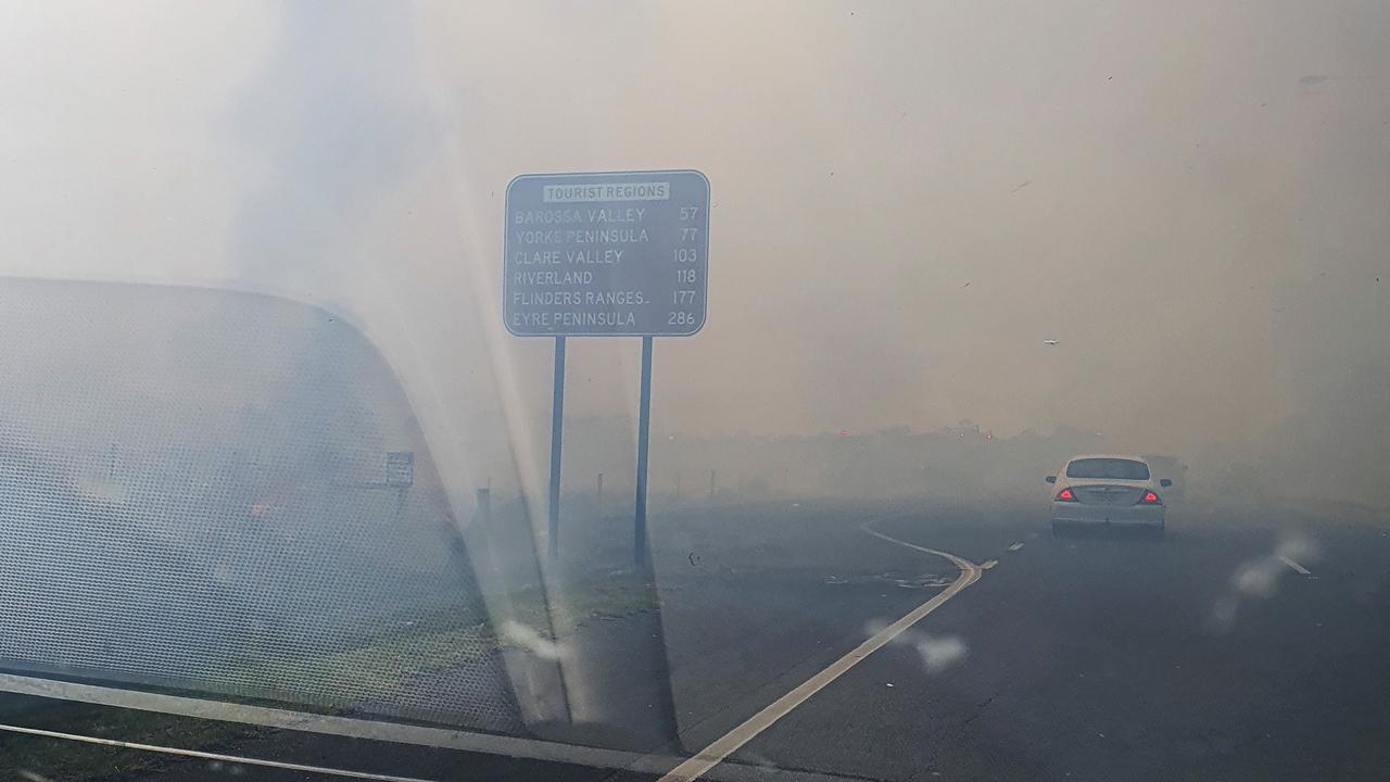 Thick smoke reduced visibility across Port Wakefield Road. Picture: Paris Charles