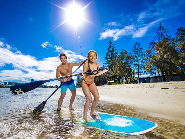 Weather - Gold Coast.Emily Giesler from Los Angeles and Alex Kadar from Philadelphia enjoy the first Blue Sky Day for what feels like months at Budds Beach on their last day of holidays on the Gold Coast before heading to Townsville.Picture: NIGEL HALLETT