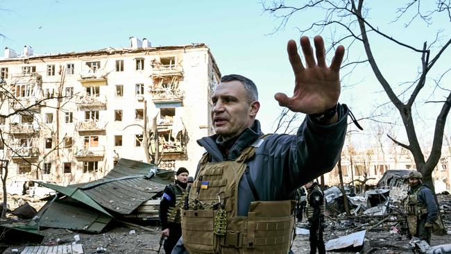 Kyiv's mayor Vitali Klitschko holds people away from a five-storey residential building that partially collapsed in Kyiv. Picture: AFP.