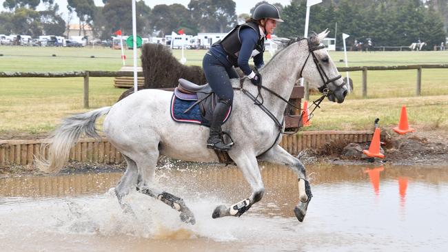 Making splash: Kate Wallis riding Harrold Esquire, winner of a one-star class. Picture: Tazzie Eggins