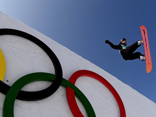 TOPSHOT - China's Yiming Su competes in the snowboard men's big air final run during the Beijing 2022 Winter Olympic Games at the Big Air Shougang in Beijing on February 15, 2022. (Photo by MANAN VATSYAYANA / AFP)