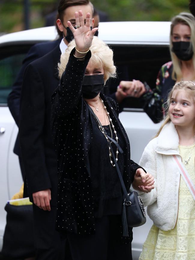 Patti waves to well-wishers who gathered outside. Picture: Matrix