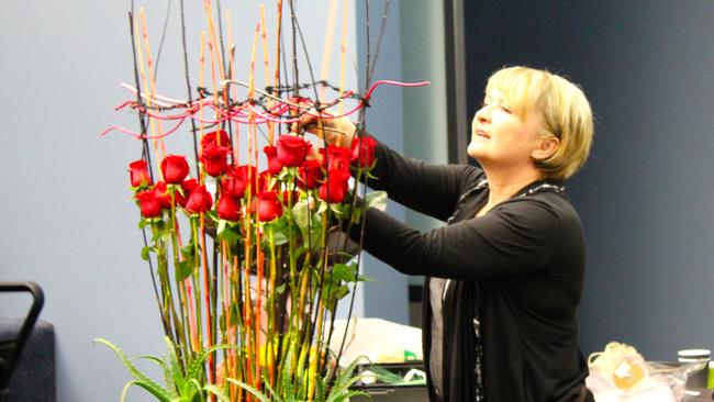 Northern Sydney Institute of TAFE teacher Elzbieta Wakeham demonstrates flower arranging.