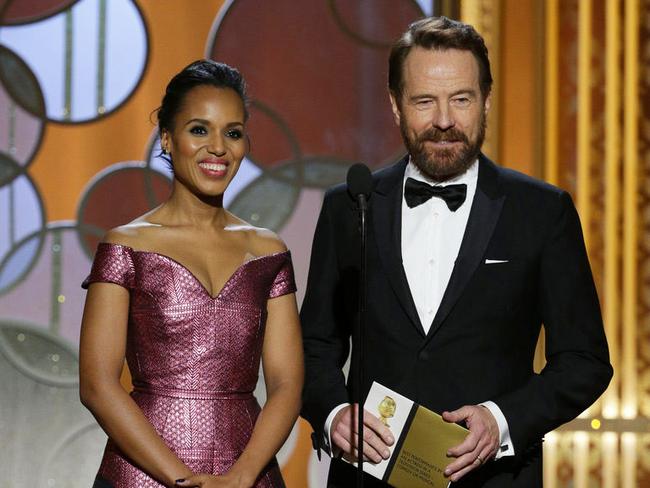 Kerry Washington and Bryan Cranston present an award on stage.