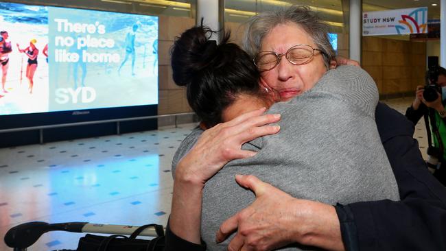 A mother and daughter are reunited at Sydney's International Airport on Monday. Picture: Getty Images