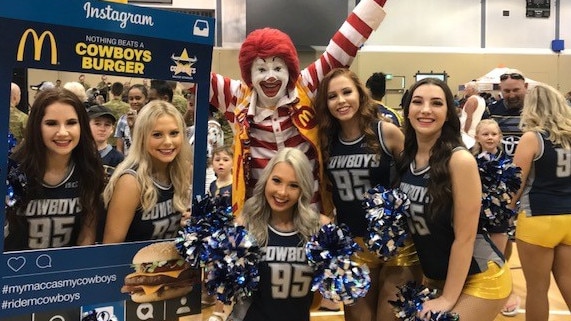 Ronald McDonald with the North Queensland Cowboys Spirit Cheerleading Squad at the club's recent Cowboys Community Day.