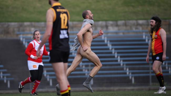 A streaker runs through a game at which Labor leader of the opposition Anthony Albanese and his AFL team the Western Walers played the Sailors in a charity match in Marrickville in 2019. Jane Dempster/The Australian.