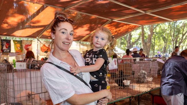 Jolanta Hebberman and her little girl checking out the chickens. Picture: Pema Tamang Pakhrin