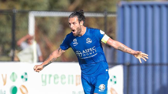 Adelaide Olympic captain Ricardo Da Silva celebrates after scoring in his side's match against MetroStars. Picture: Adam Butler