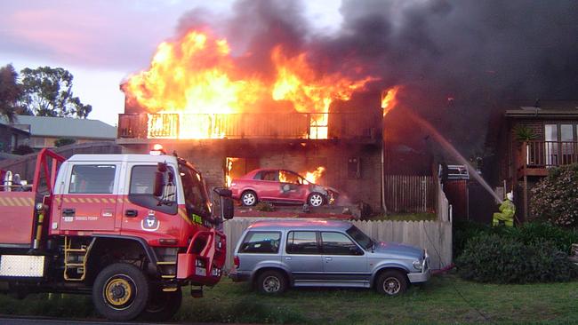 Crews from Dodges Ferry, Primrose Sands, Midway Point and Orielton attended the house and car fire at Carlton yesterday. Picture: JOHN ANDREWARTHA