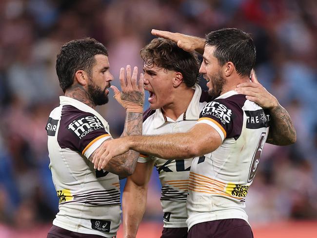 SYDNEY, AUSTRALIA - MARCH 06: AdamÃÂ Reynolds, Ben Hunt and Reece Walsh of the Broncos celebrate winning the round one NRL match between Sydney Roosters and Brisbane Broncos at Allianz Stadium on March 06, 2025, in Sydney, Australia. (Photo by Cameron Spencer/Getty Images)