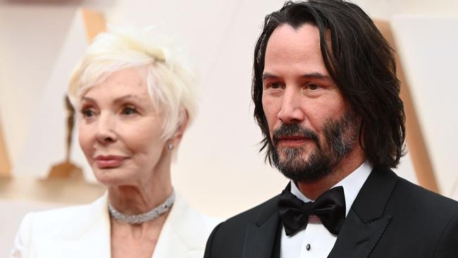 US actor Keanu Reeves (R) and his mother Patricia Taylor arrive for the 92nd Oscars at the Dolby Theatre in Hollywood, California on February 9, 2020. (Photo by Robyn Beck / AFP)