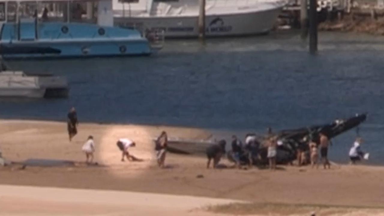 Leon de Silva being dragged from the helicopter wreckage on January 2.