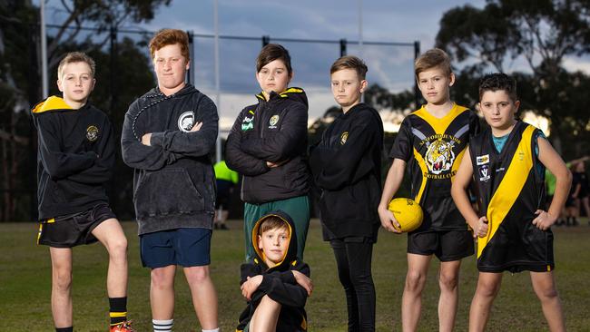 The Seaford junior footy club is devastated after thieves broke into their club rooms and stole their equipment and uniforms. L to R Cameron, 11, Max, 12, Jack, 12, Jensen, 11, Casper, 12, Levi, 11, with Nate, 9, at front. Picture: Mark Stewart