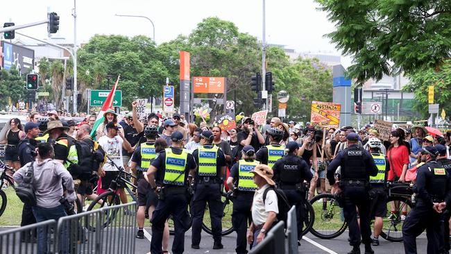 Protesters are seen outside the Gabba alongside a strong police presence. Picture: AFP.