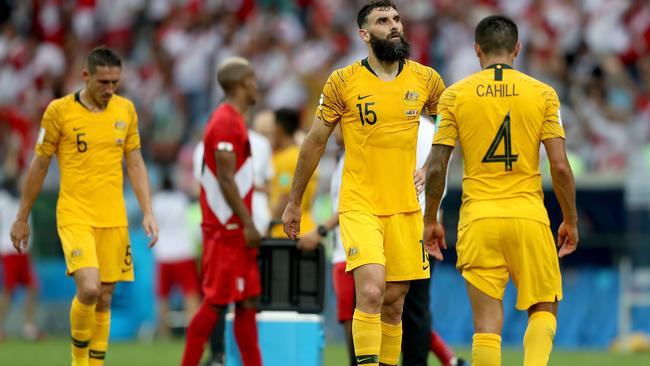 A dejected Mile Jedinak following the Socceroos’ defeat. Picture: Getty Images.