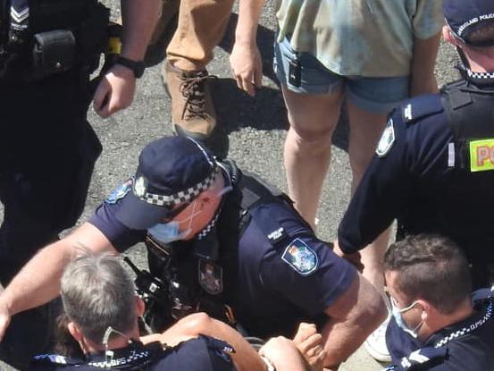 Police arrest a man at the border protest. Picture: Supplied